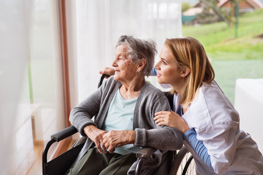 Caregiver assisting a senior with daily living at home in Akron, OH — home health care service Caregiver assisting a senior with daily living at home in Akron, OH — home health care service